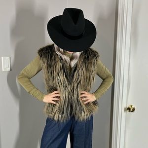 Faux fur vest by Lundstrom.